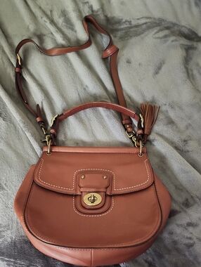 Coach Willis Tan Leather Crossbody Saddle Bag with Tassel.